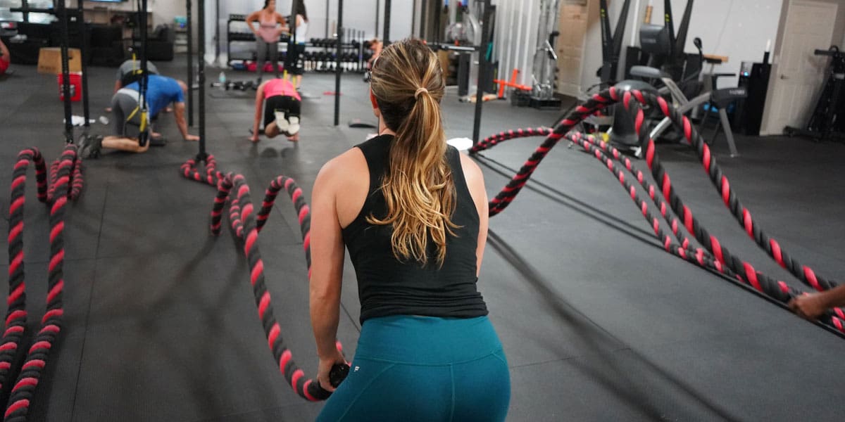 Crossfit athlete battle ropes workout